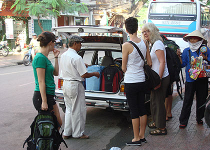 Local Driver Helping with the Luggage, Vietnam