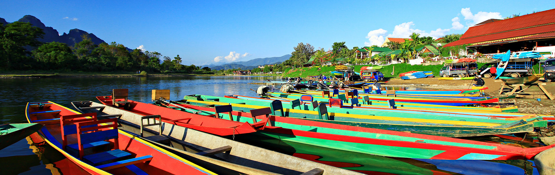 Colorful boats floating over Nam Song River of Vang Vieng