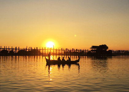 Tourists appreciate the sunset of U Bein Bridge