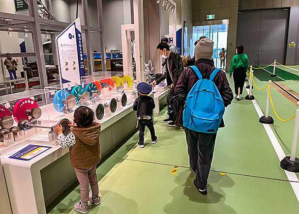 Kids having fun learning how the cogs work