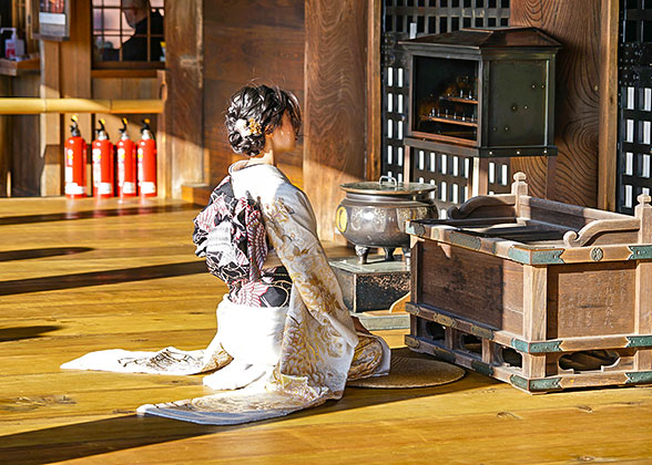 Praying girl in formal way of sitting