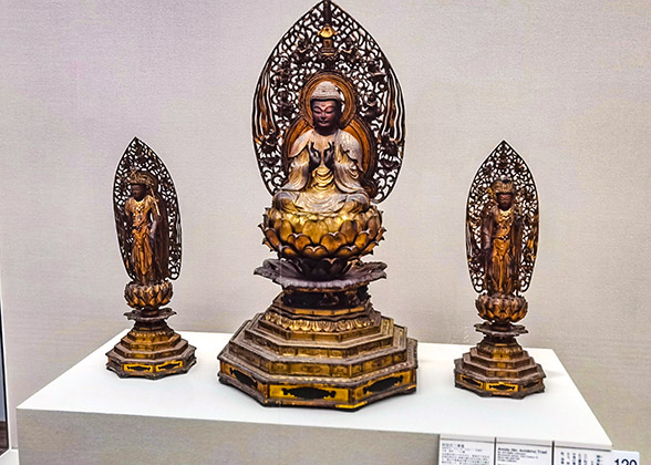 Three golden-colored buddhist sculptures