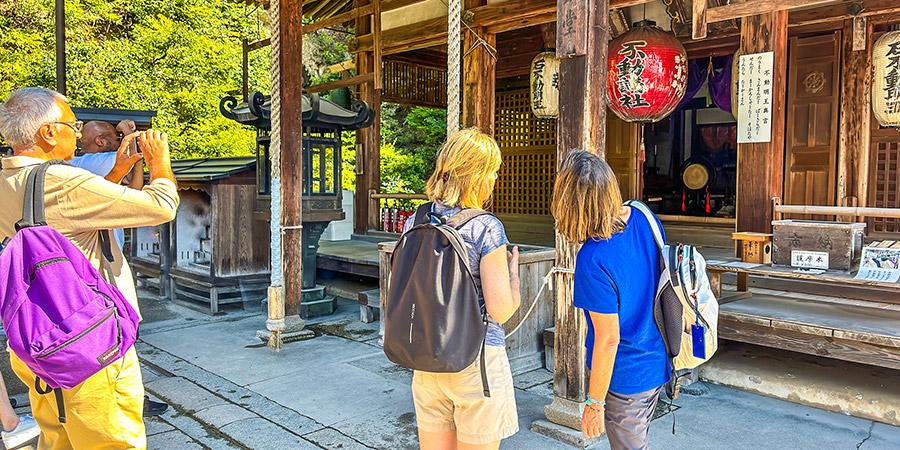 Visitors are taking photos before one building