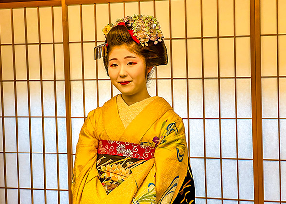 A Geisha with exquisite makeup and costume