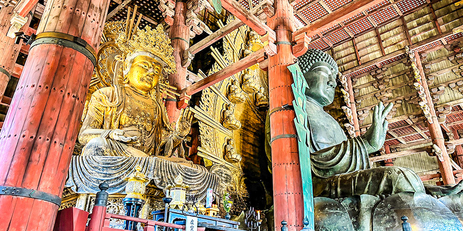 Golden Bodhisattva next to the Bronze Buddha Statue
