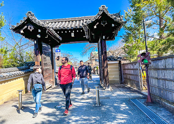 Visitors standing at the entrance of the Temple