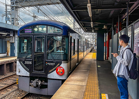 A passenger is waiting on the train platform
