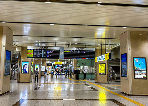 The clear signboards hang in the station of Kyoto Subway