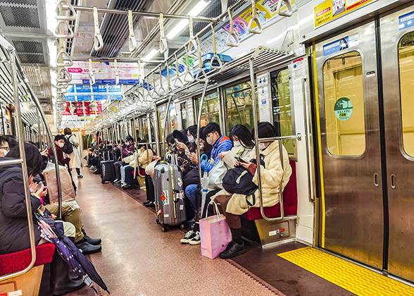 Passenger sitting in Kyoto Subway