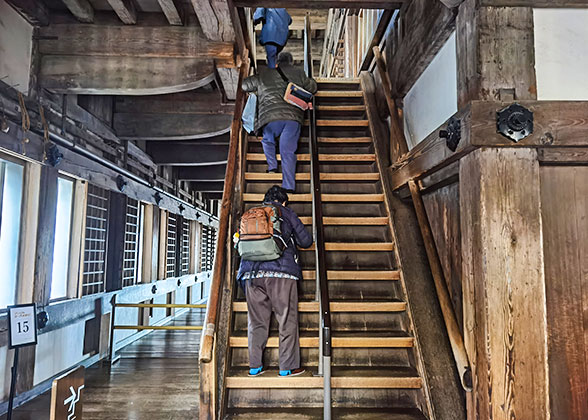 Tourists climbing the stairs in Matsumae Castle