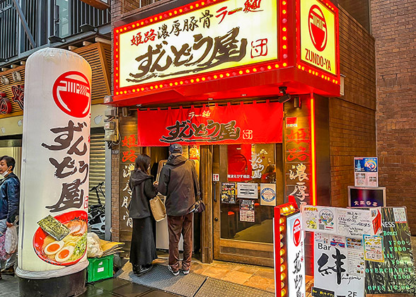 Customers before a ramen restaurant