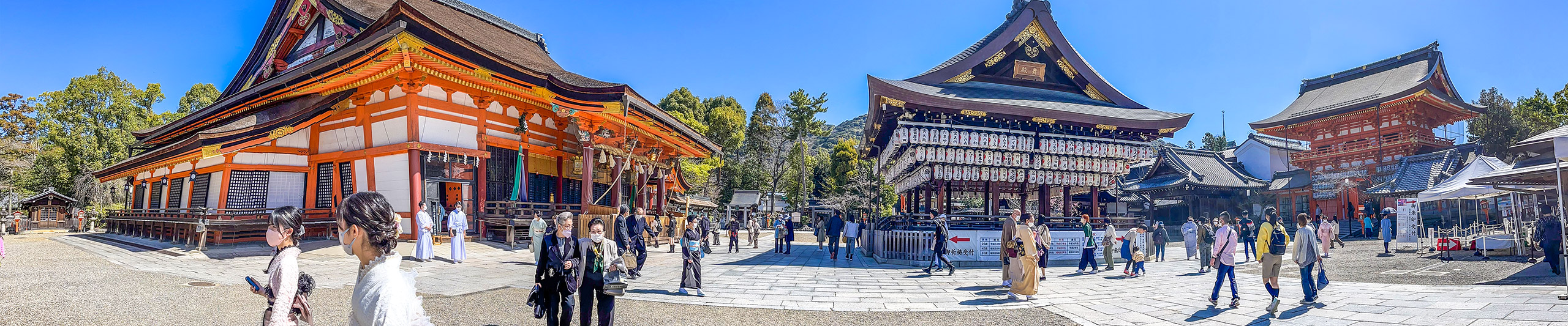 Visitors scattered among the buildings in Yasaka Shrine