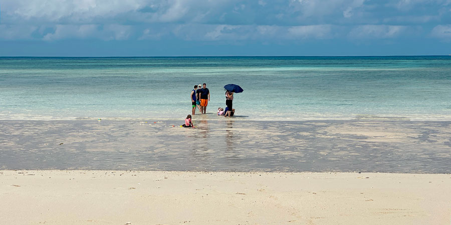 People Enjoying the Jewel-like Sea