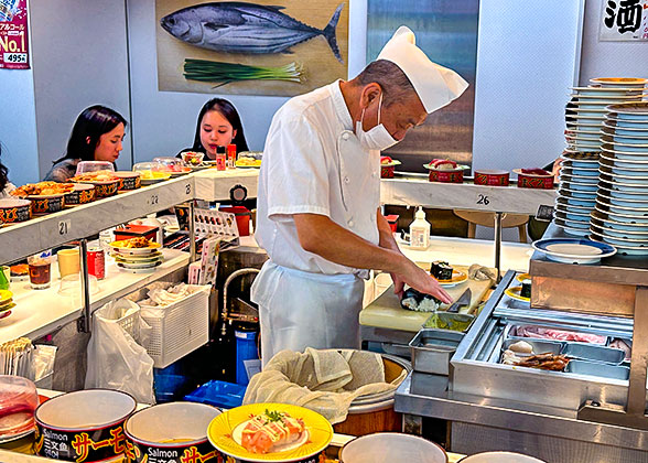 Cook Making Sushi at a Local Restaurant