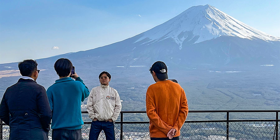 Tourists Taking Photos with Snowcapped Mt. Fuji