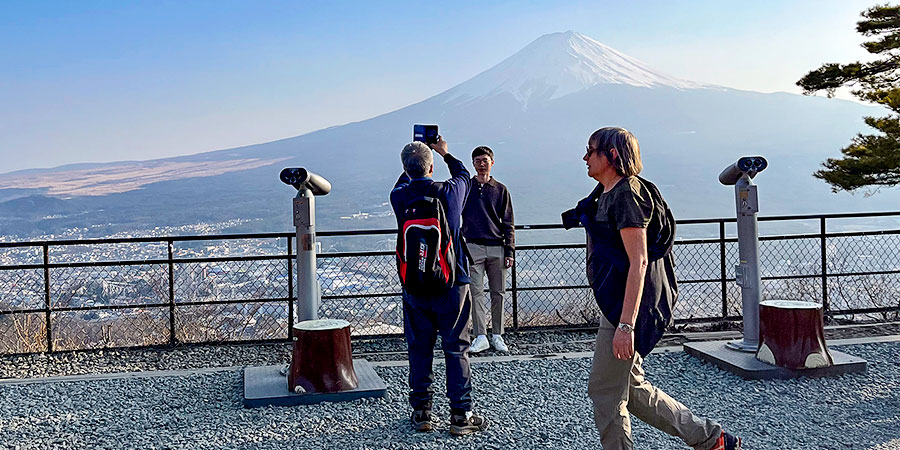 Visitors Taking Photos with Snowcapped Mt. Fuji