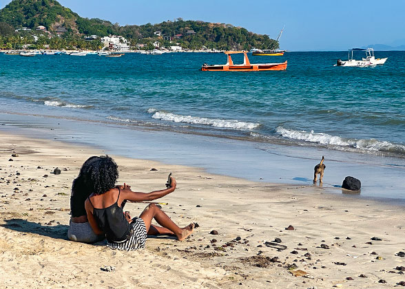 People Sunbathing on the Beach