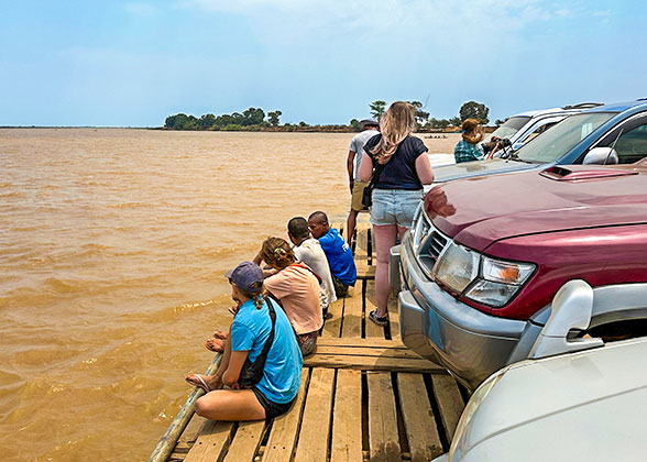 People Taking Ferry in Dry Season