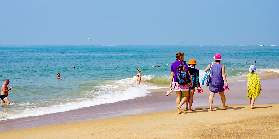 Tourists Strolling along the Beach