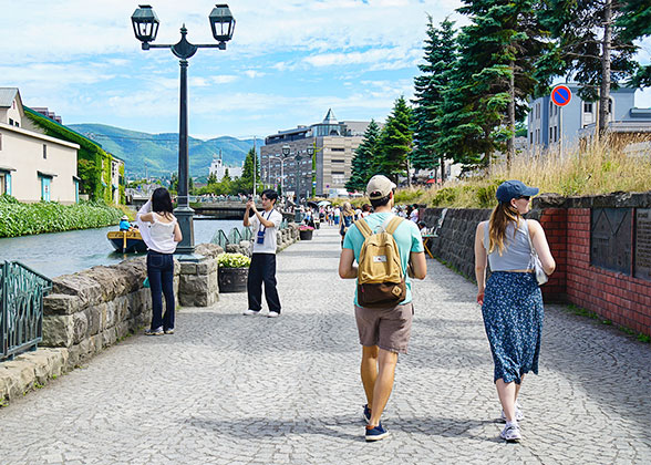 Tourists stroll along the Otaru Canal