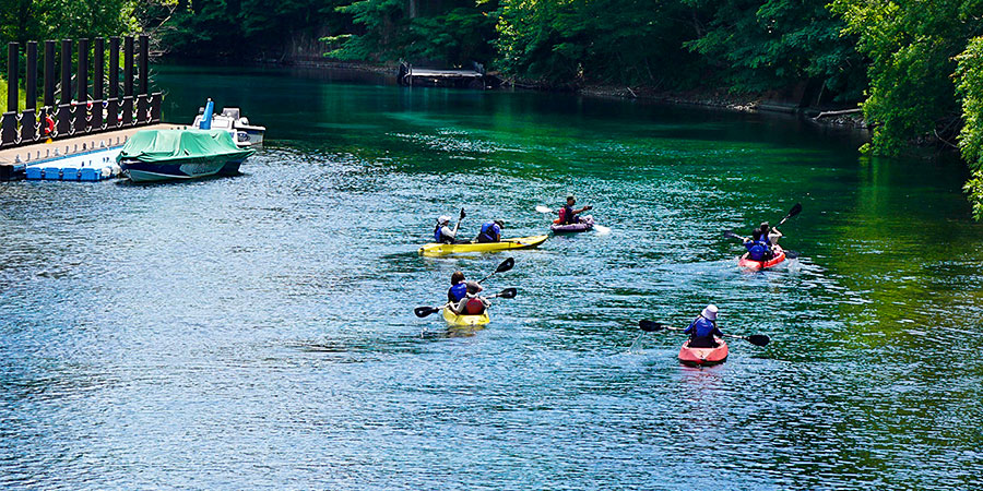People Enjoying White-Water Rafting