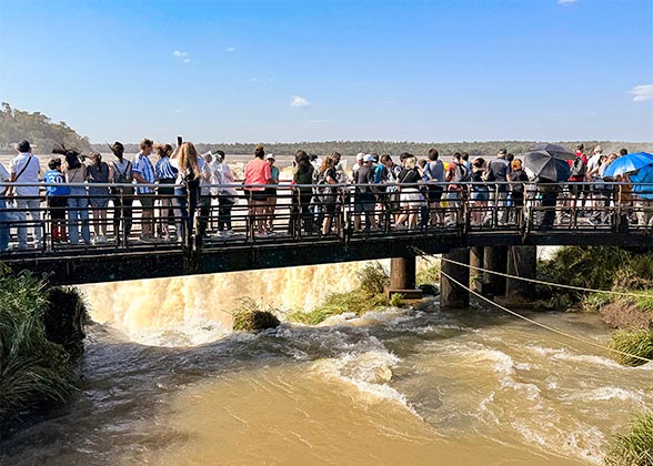 Admiring Falls on the Suspended Walkway, Argentina