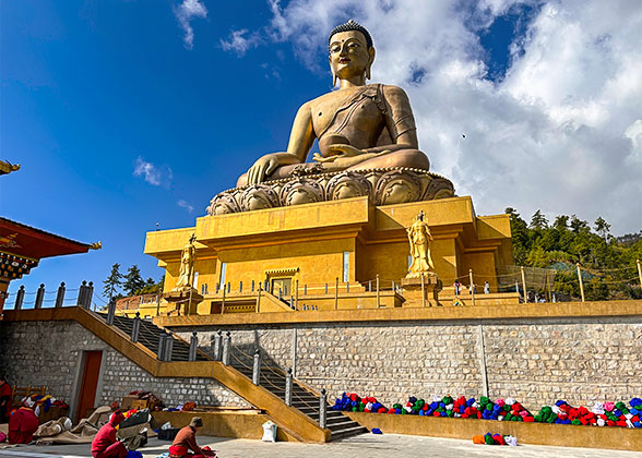 Bhutanese Monks under the Buddha Dordenma Statue