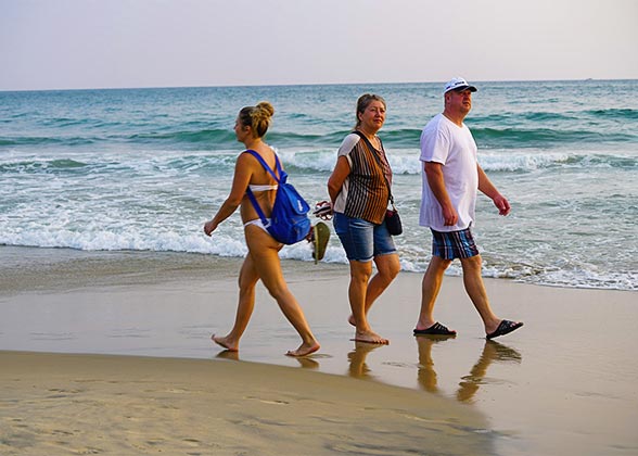 People Strolling along Renaca Beach