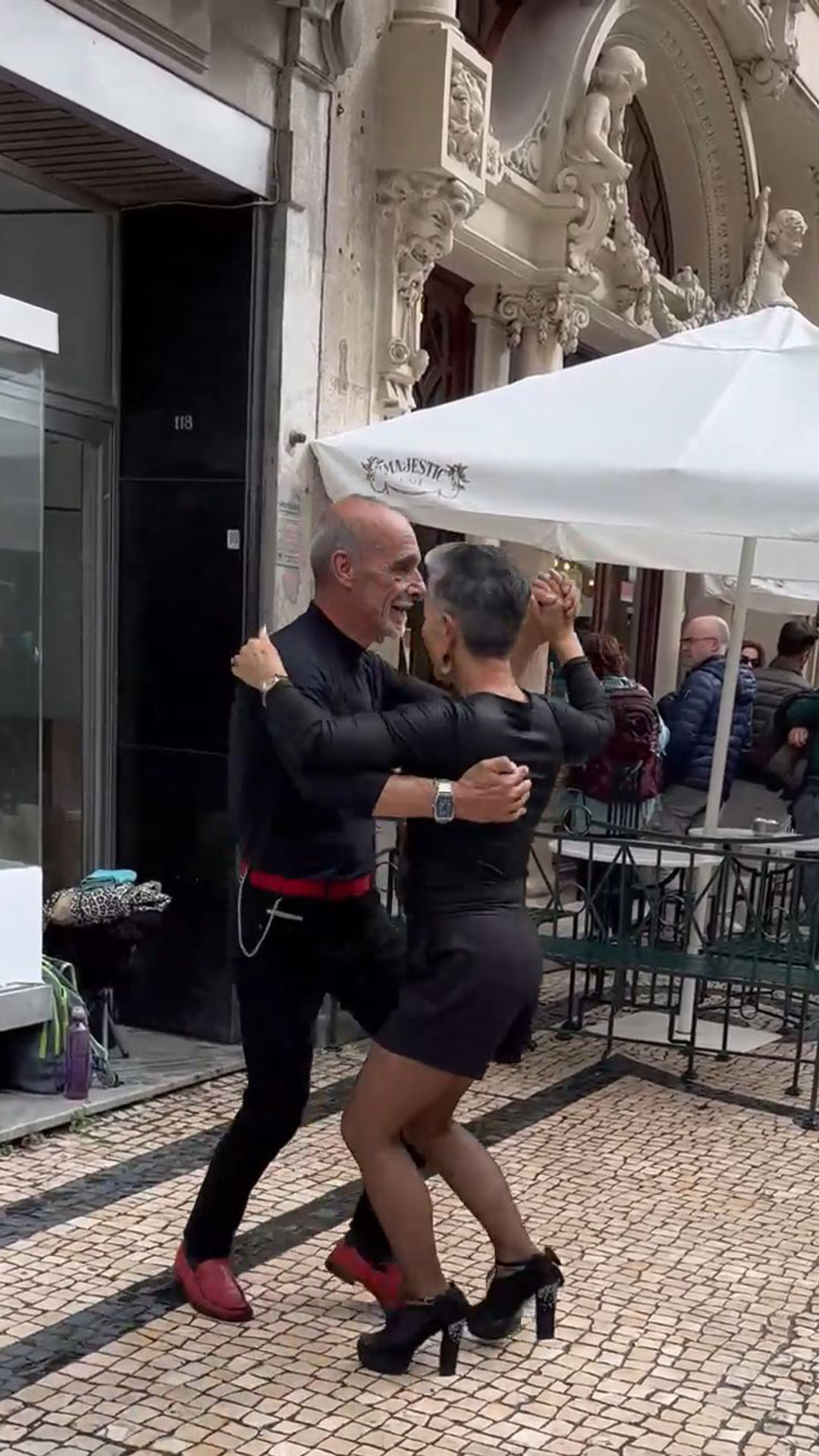 Locals Happily Dance on the Street of Porto
